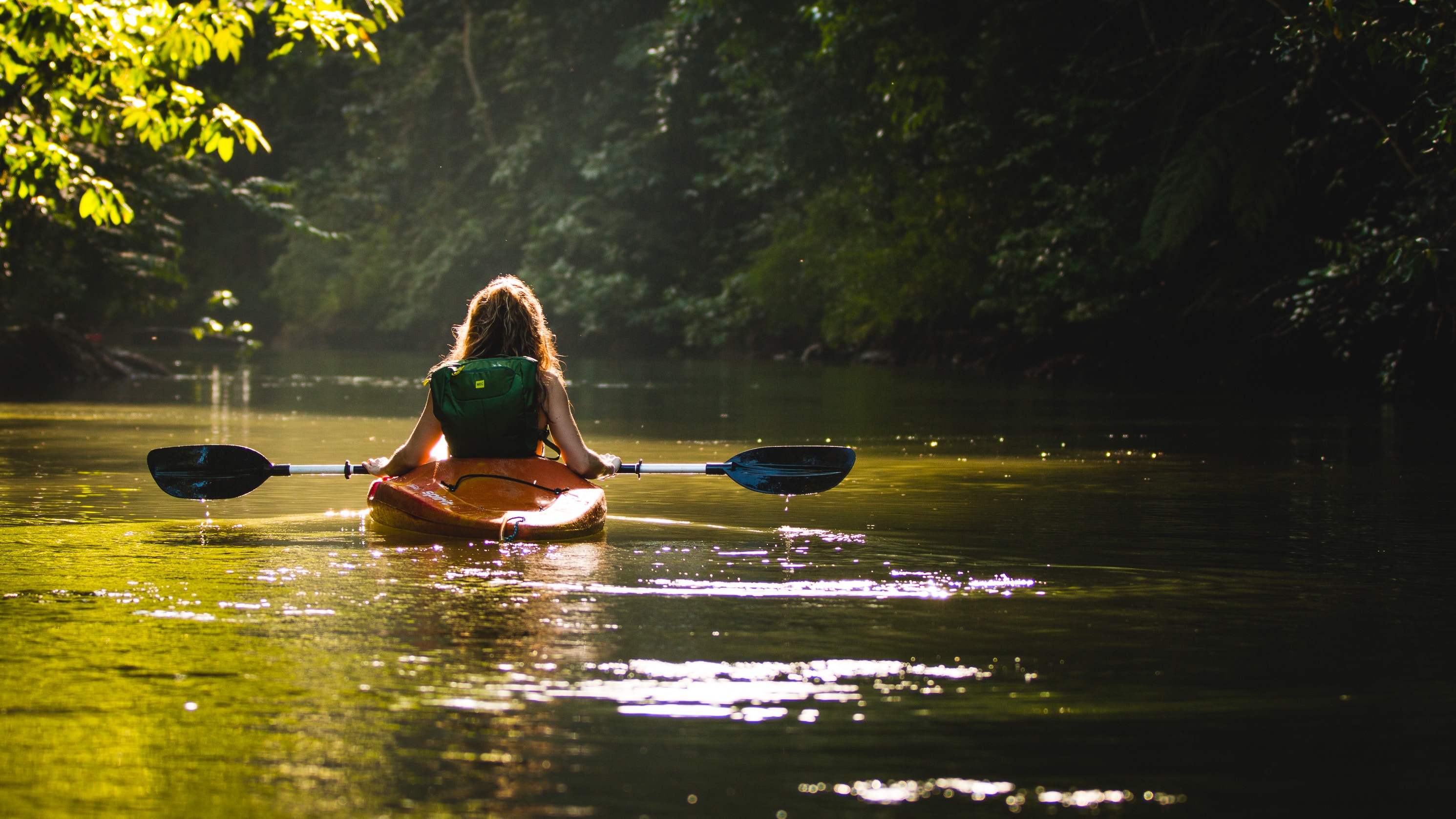 woman kayaking on Orara River Coffs hinterland